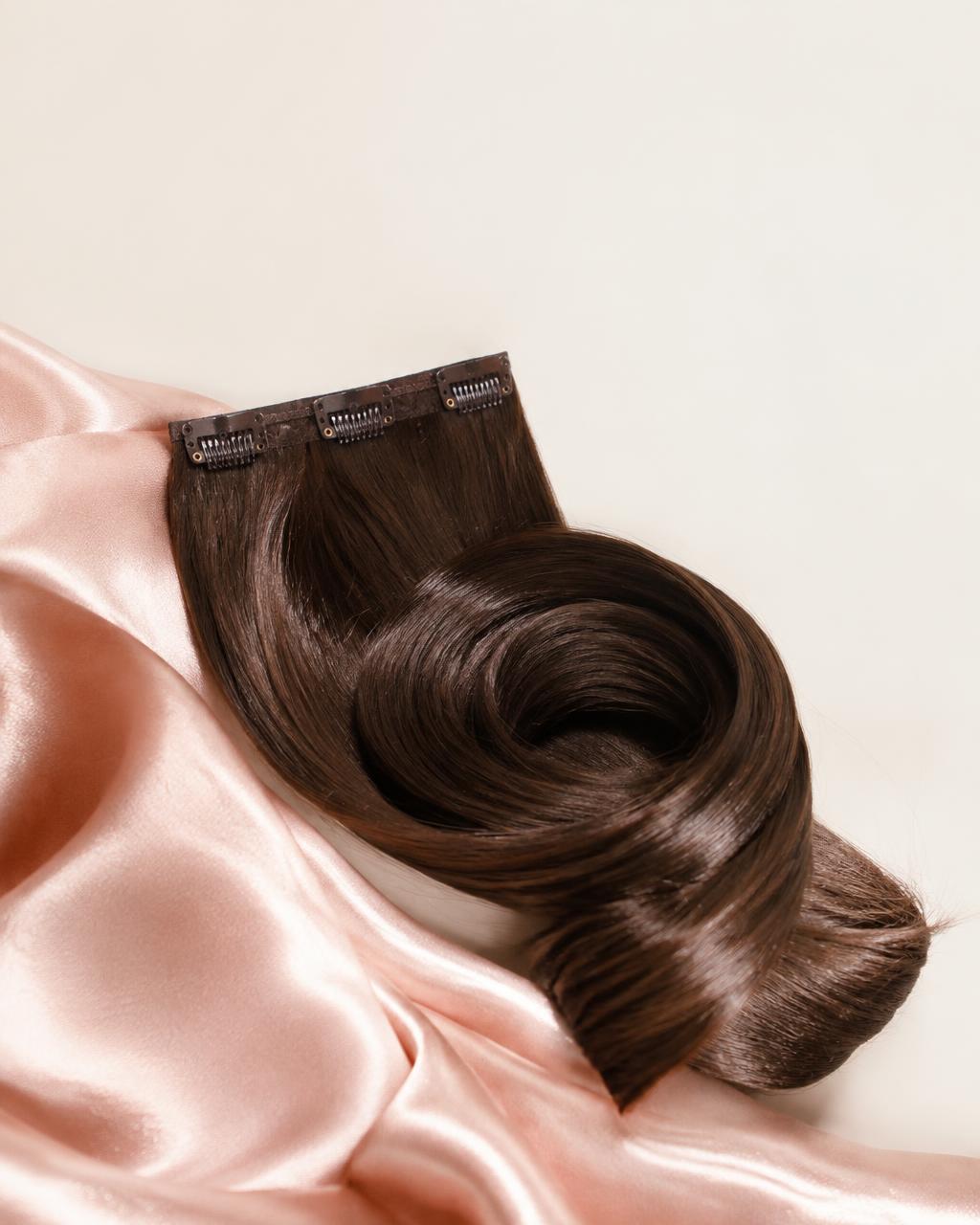 Clip-in hair extension on satin